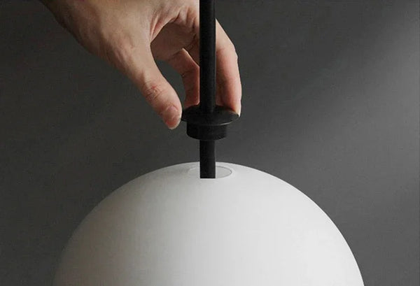 Modern LED pendant light with white glass sphere, interior decoration accessory