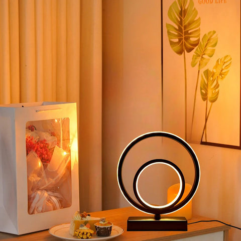 Modern and minimalist ring-shaped table and bedside lamp. USB powered.