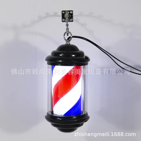 Mini wall light for hair salon, barber shop pole with elegant design and black structure.