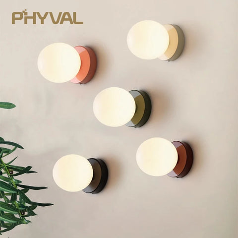 Nordic minimalist glass LED wall light with G9 base, orb style sconce